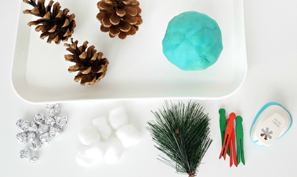 Supplies for a pine cone sensory tray activity