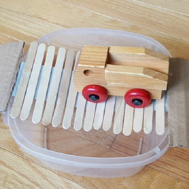 Craft stick and duct tape bridge building STEM for preschool