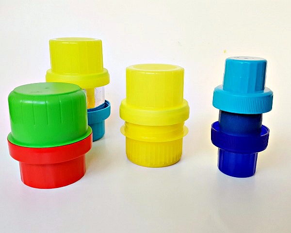 Glue or tape bottle lids together to make musical shakers