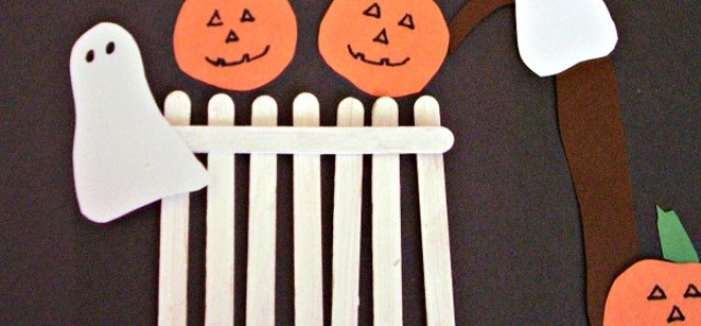 Pumpkins and ghosts on a craft stick fence Halloween art activity for preschoolers