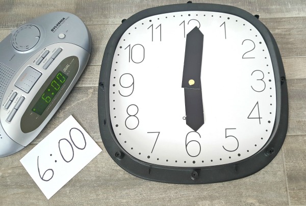Use a digital and an analog clock in early learning activities