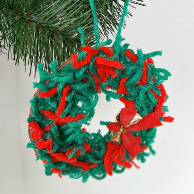 Yarn scraps wreath Christmas ornament craft for kids